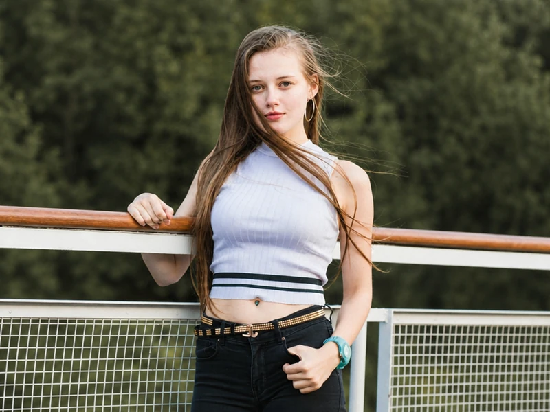 Outdoor portrait of a woman leaning on a railing