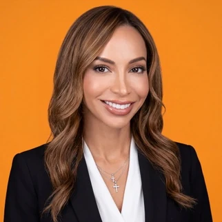 A bright orange background behind a smiling portrait