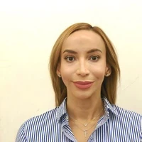 Close-up selfie with a striped shirt and pale background