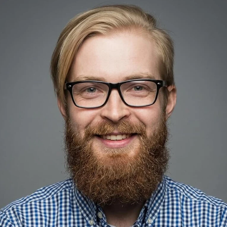 Centered portrait with glasses against a gray background